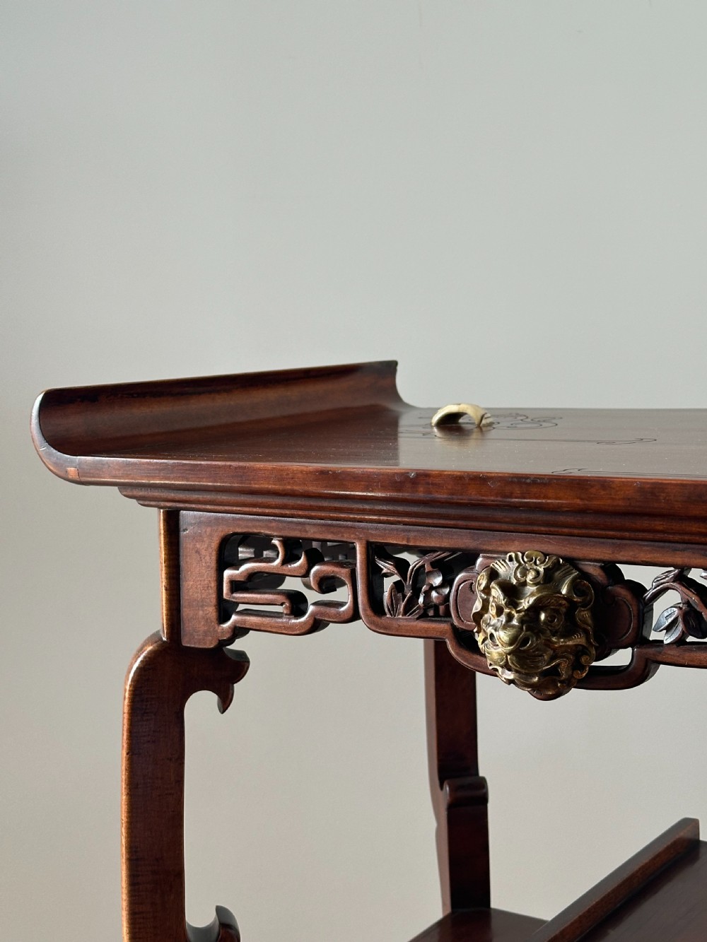 A late 19th-century French Japonisme side table featuring a curved pagoda top, open asymmetrical shelves, pierced wood carving, and a gilt-bronze motif. View VIII