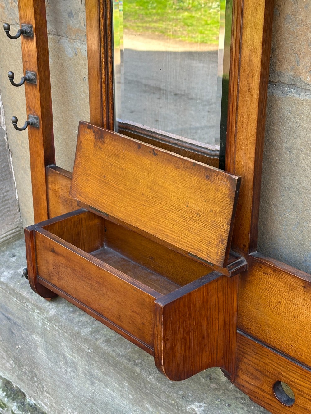Attributed to James Shoolbred, an Aesthetic Movement oak and brass-mounted hall rack View III