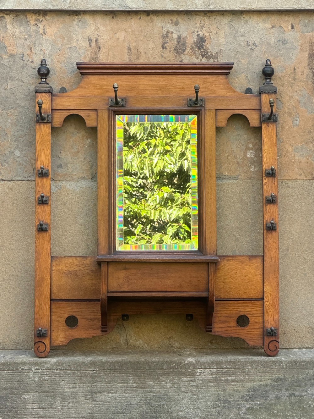 Attributed to James Shoolbred, an Aesthetic Movement oak and brass-mounted hall rack View II