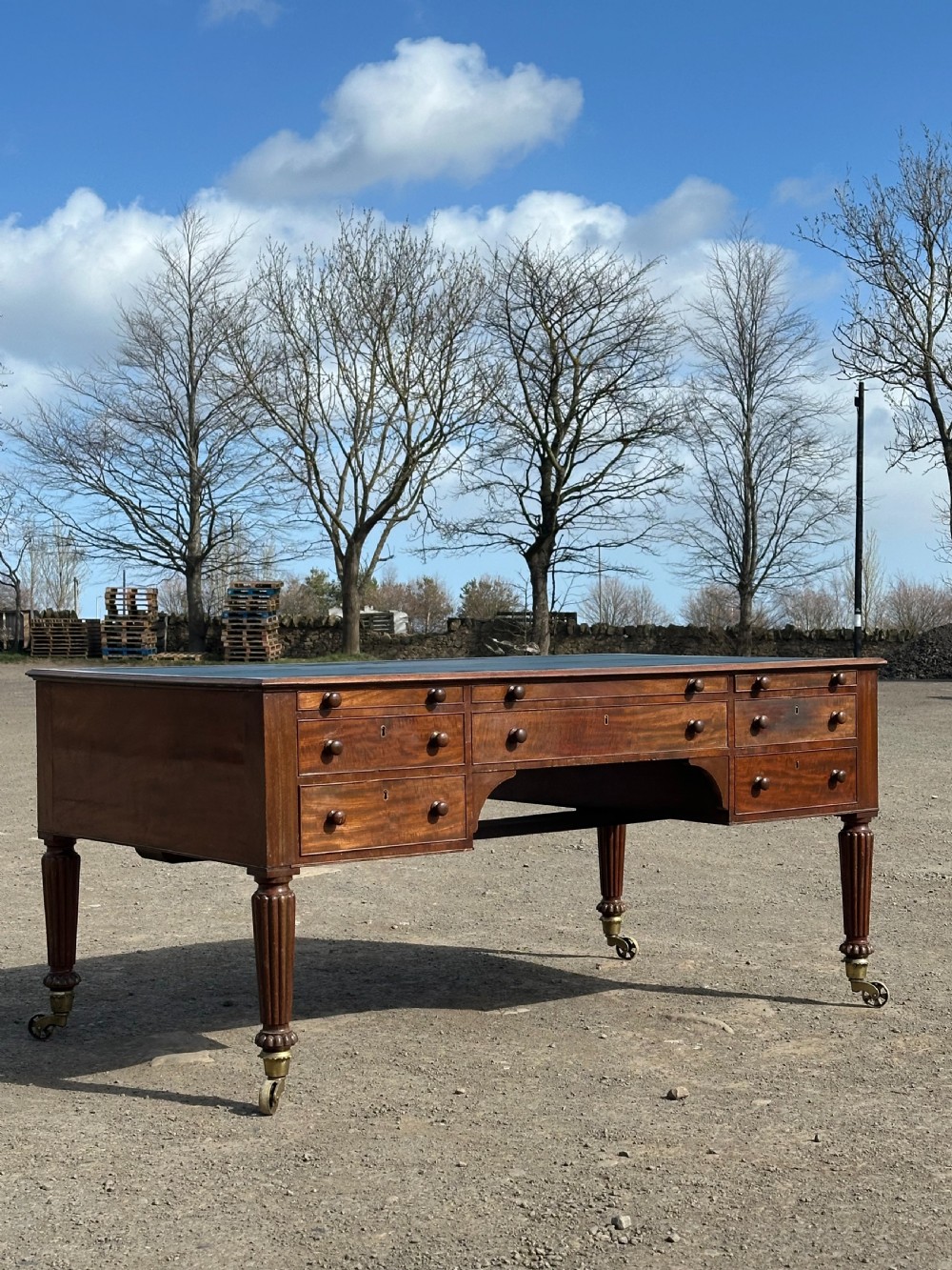 An imposing George IV mahogany partners desk in the manner of Gillows c.1820 View II