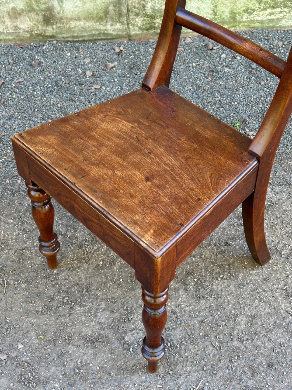 A set of four Victorian birch side chairs featuring curved top rails, turned front legs, and solid timber seats. View VI