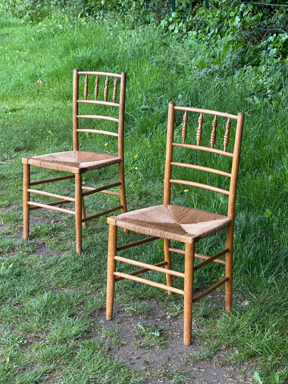 A pair of 19th century beech and ash Sussex chairs, very likely made for Morris & Co.