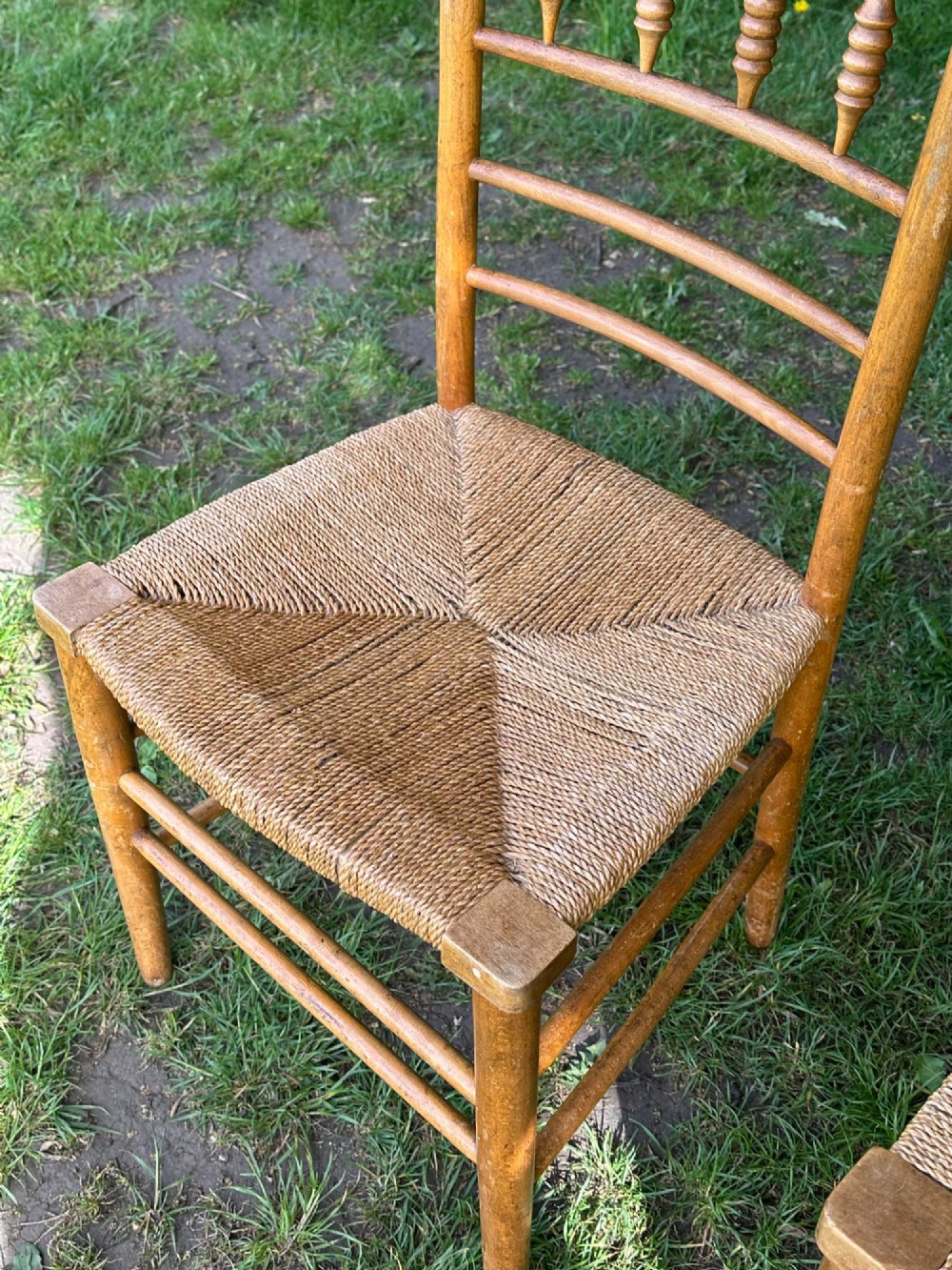 A pair of 19th century beech and ash Sussex chairs, very likely made for Morris & Co. View V
