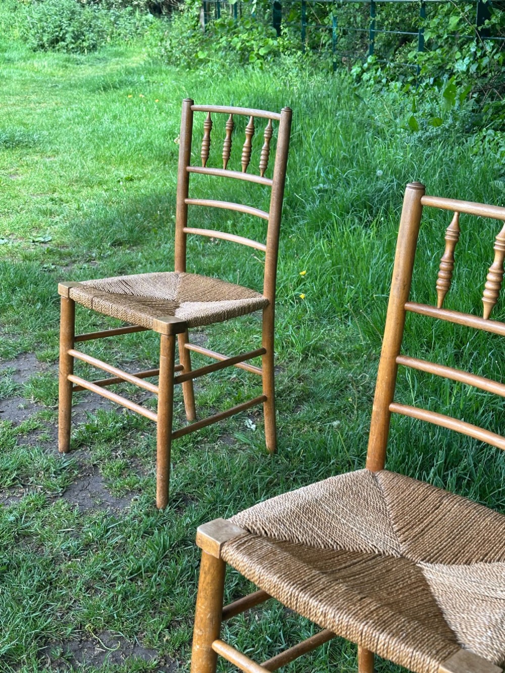 A pair of 19th century beech and ash Sussex chairs, very likely made for Morris & Co. View VII