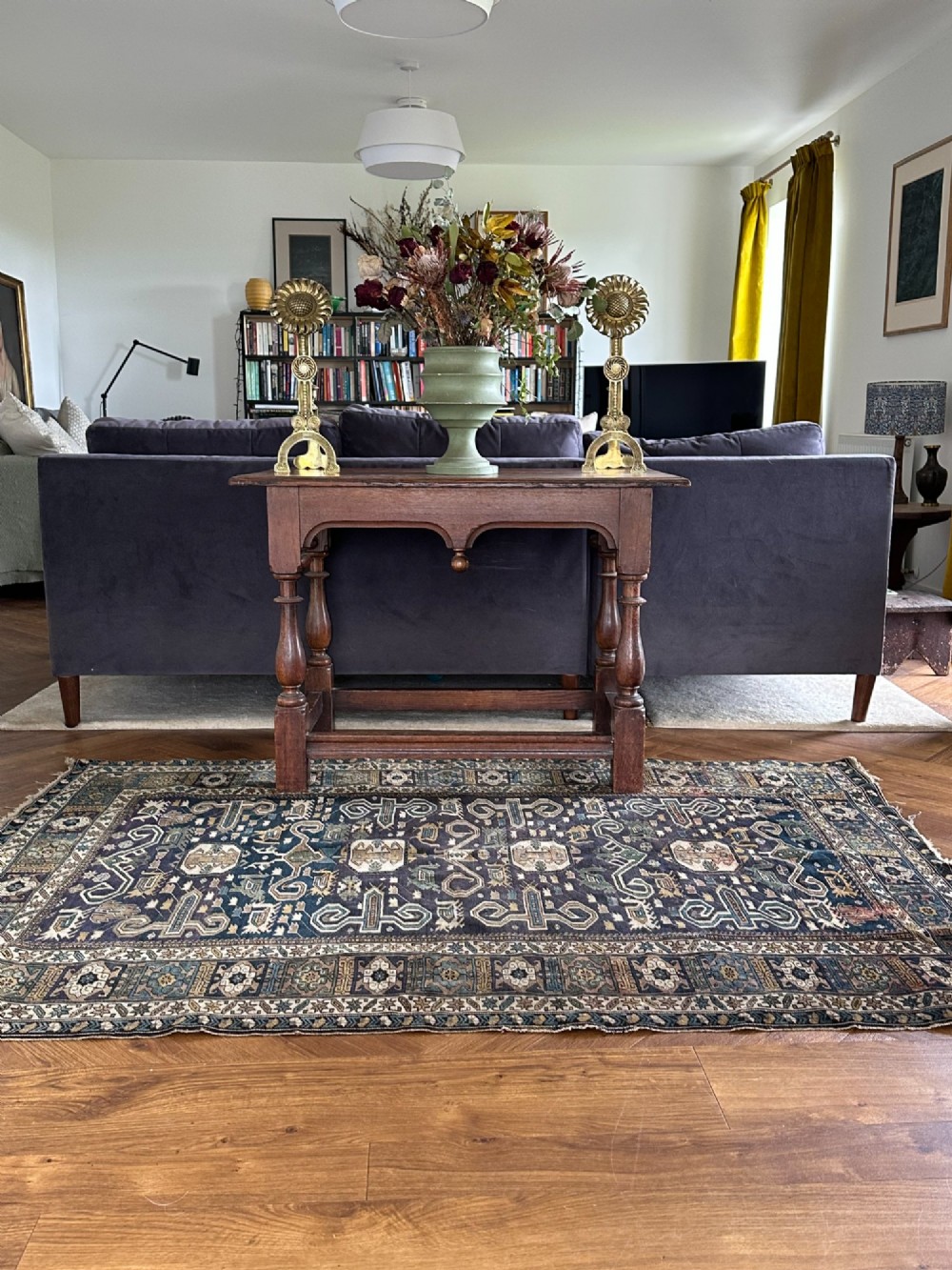 An antique East Caucasian Shirvan rug featuring a dark navy blue field filled with geometric medallions, stylized bird motifs, and multi-band patterned borders. View II