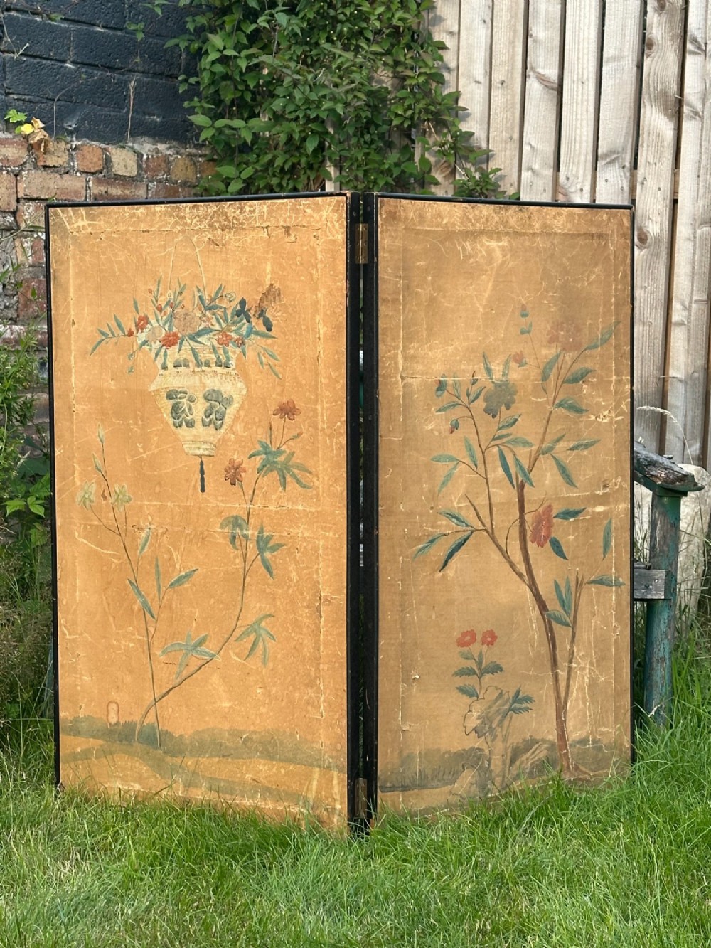 A late nineteenth-century two-panel folding screen featuring hand-painted Japanese coastal and mountainous landscapes framed in dark wood. View XII
