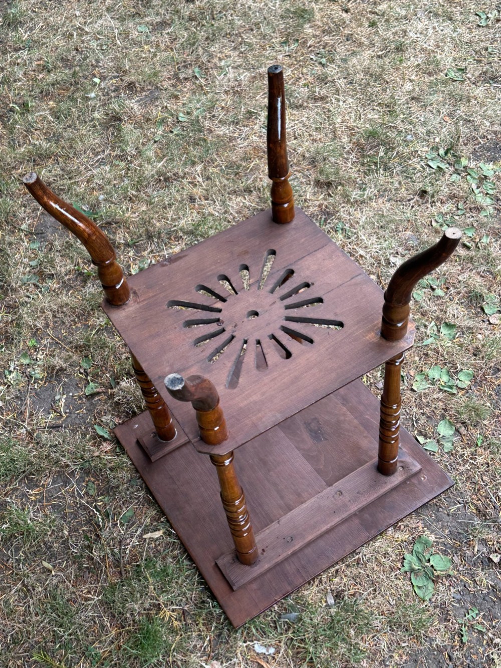 An Anglo-Japanese two-tier wooden occasional table featuring turned spindle legs, a square top, and a pierced lower shelf. View V