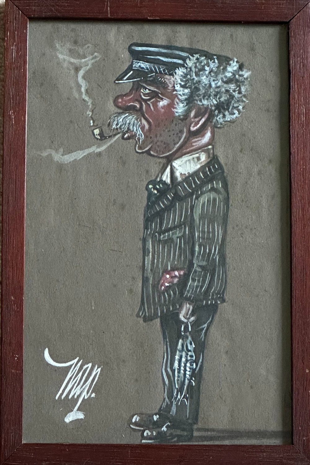 A framed 1917 caricature drawing on paper depicting a profile view of a gentleman in a flat cap holding a hand fan. View V