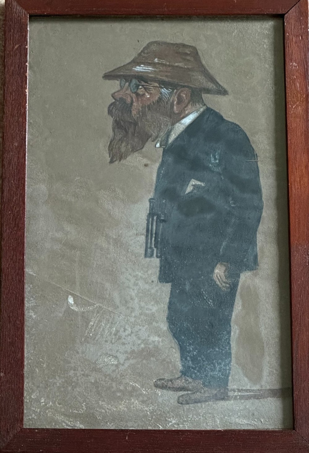 A framed 1917 caricature drawing on paper depicting a profile view of a gentleman in a flat cap holding a hand fan. View VI