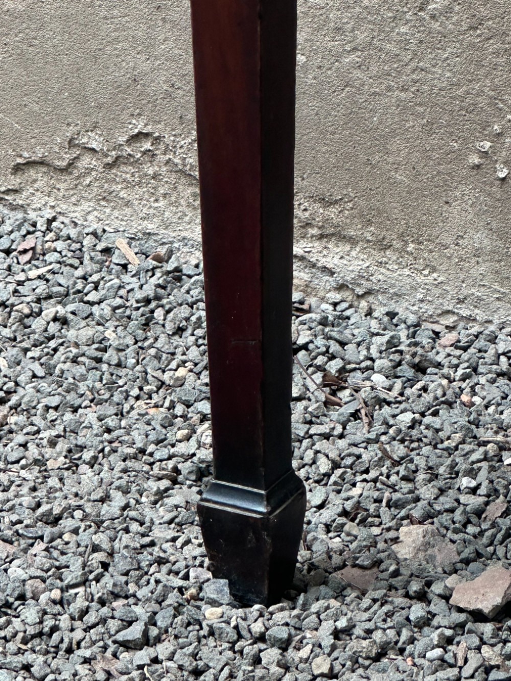 A George III mahogany side table with tapered legs, a flame mahogany veneered frieze, and a brass drawer pull. View XII
