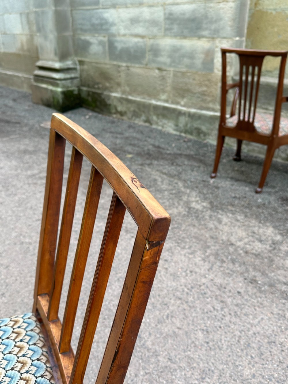 A George III solid birch side chair featuring a vertical reeded slat back, patterned geometric fabric seat, and square tapered legs with stretchers. View IX