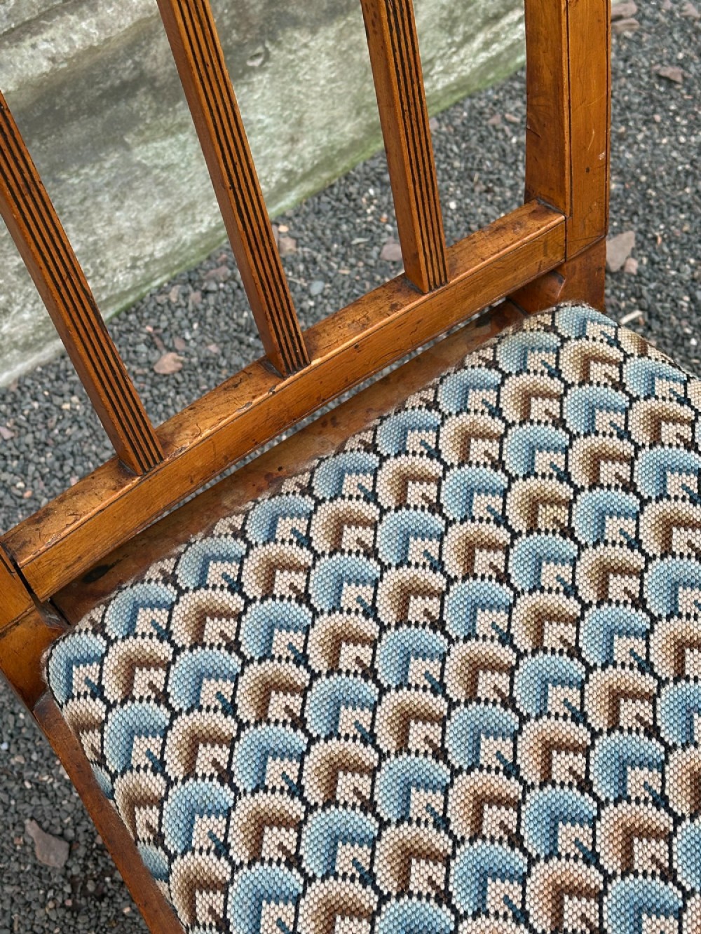 A George III solid birch side chair featuring a vertical reeded slat back, patterned geometric fabric seat, and square tapered legs with stretchers. View X
