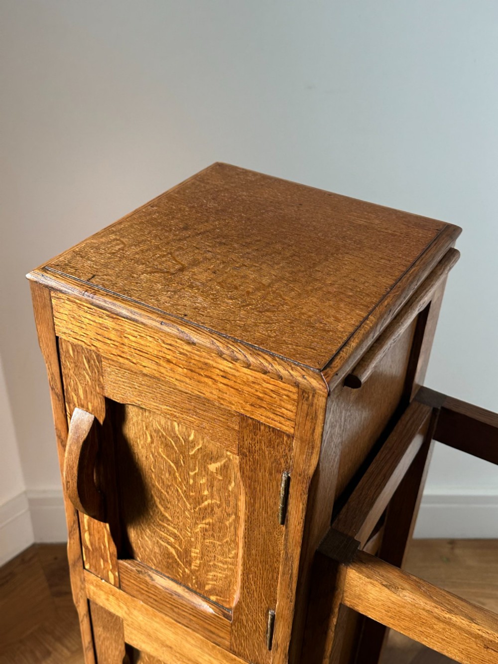 An English Arts and Crafts oak stick stand, in the manner of Heals View II