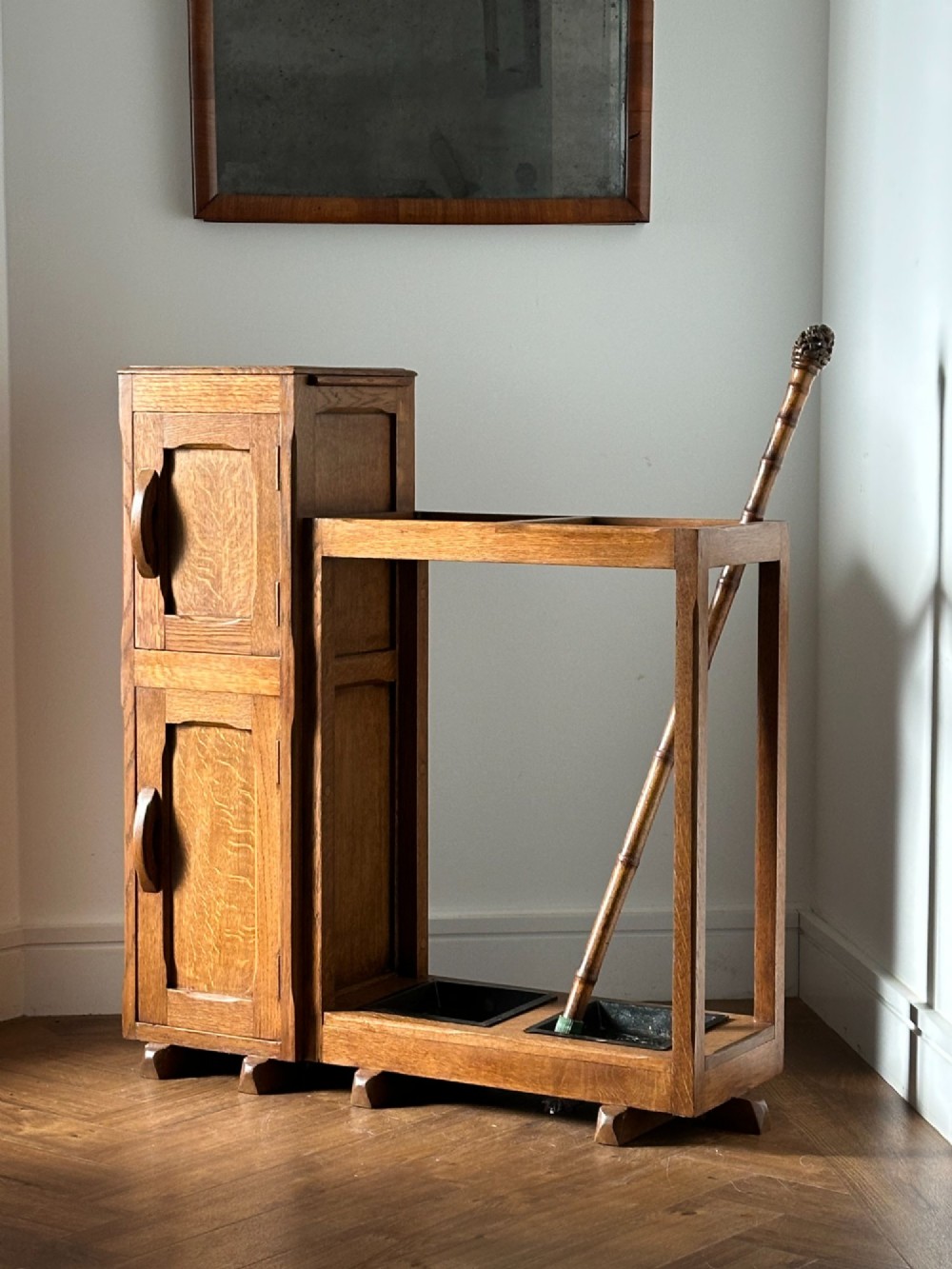 An English Arts and Crafts oak stick stand, in the manner of Heals