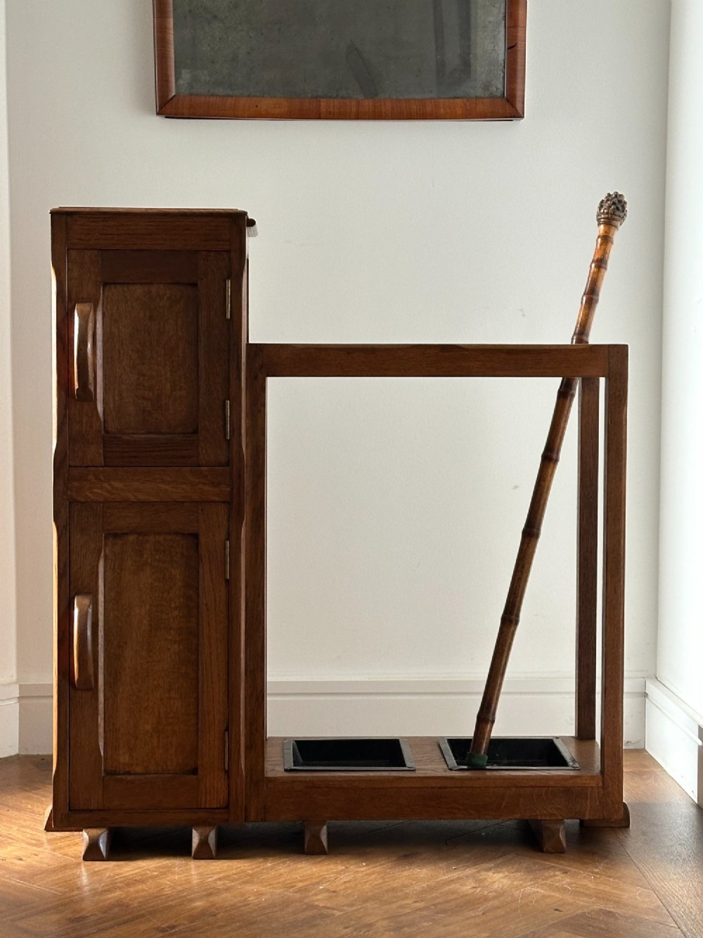 An English Arts and Crafts oak stick stand, in the manner of Heals View VIII
