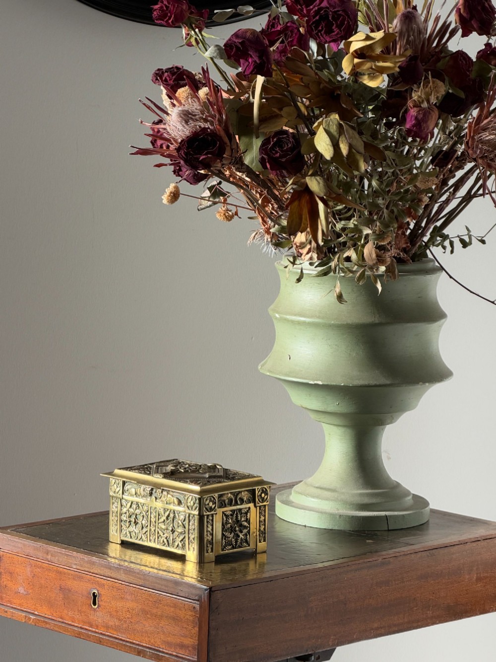 A nineteenth-century rectangular cast brass casket featuring detailed relief ornamentation of animals, foliage, and geometric patterns. View VIII