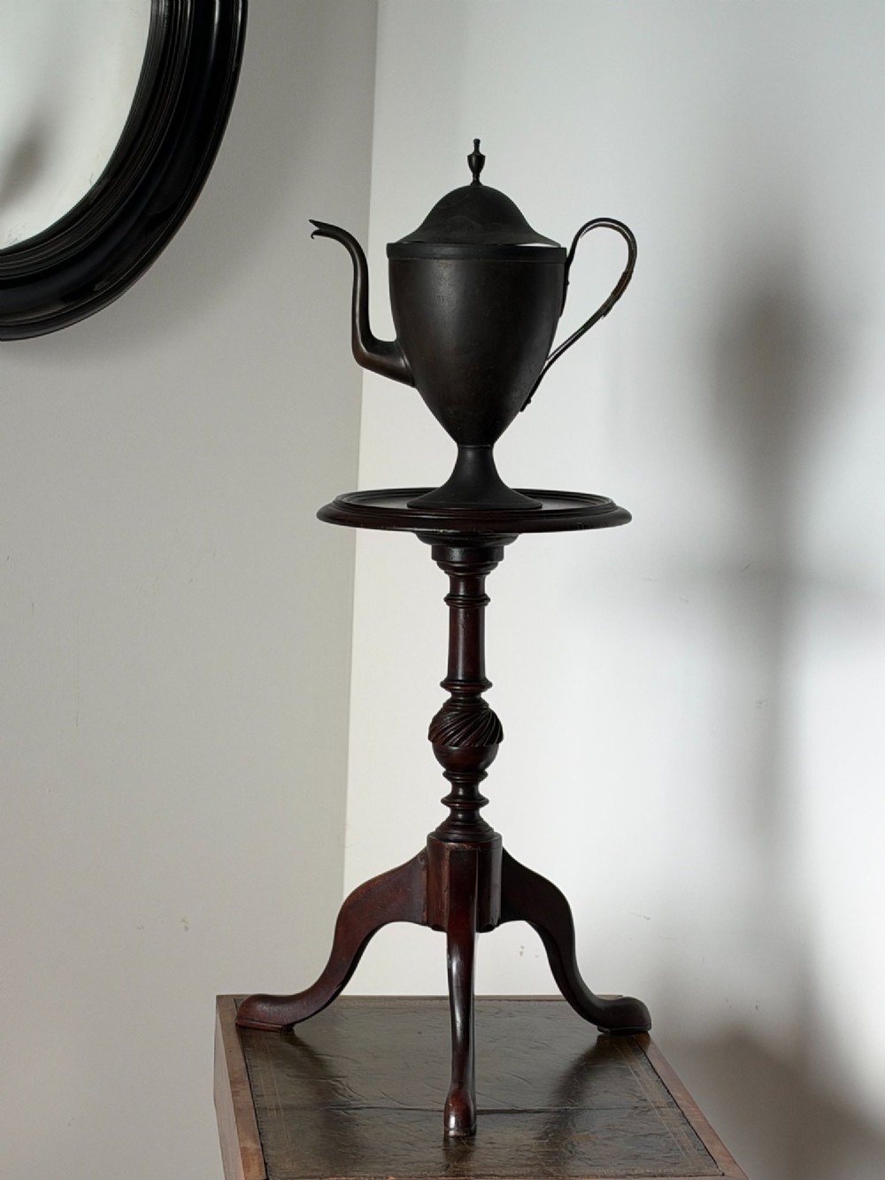 A late 19th-century George III style dark mahogany kettle stand with a circular dish top, spiral-carved baluster column, and tripod cabriole legs. View IV
