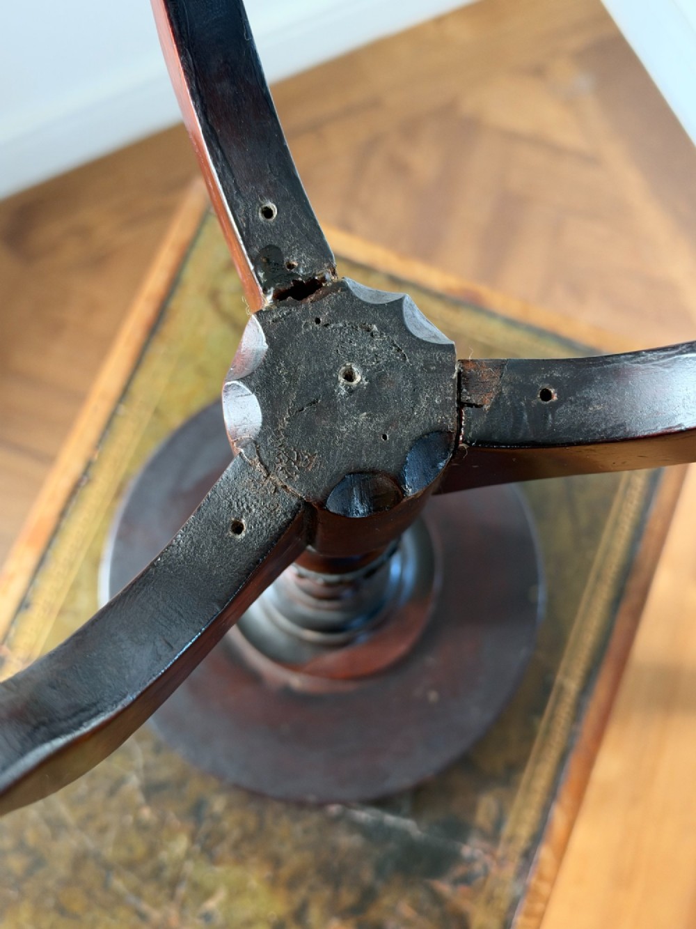 A late 19th-century George III style dark mahogany kettle stand with a circular dish top, spiral-carved baluster column, and tripod cabriole legs. View VIII