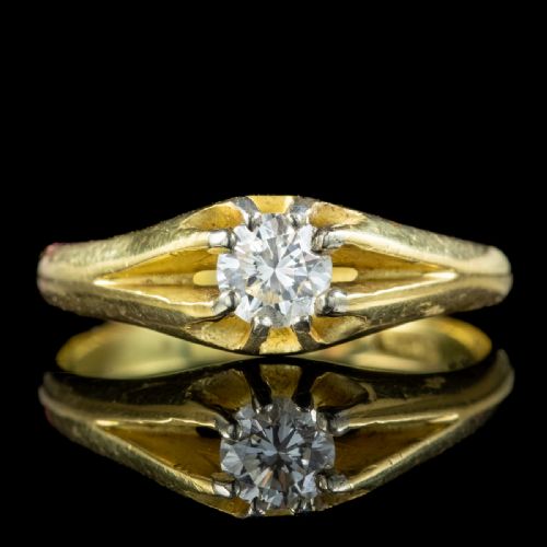 fig 1. An antique Edwardian yellow gold solitaire ring set with a single round diamond held in a carved claw setting.