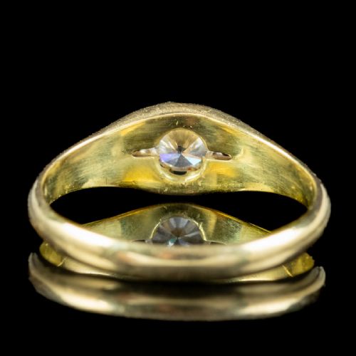 fig 2. An antique Edwardian yellow gold solitaire ring set with a single round diamond held in a carved claw setting.