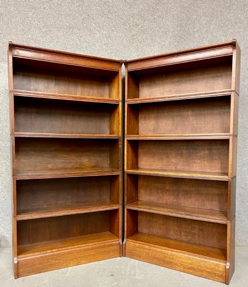 A Pair of Oak Sectional Open Bookcases by William Baker & Co. Library Furnishers  of Oxford