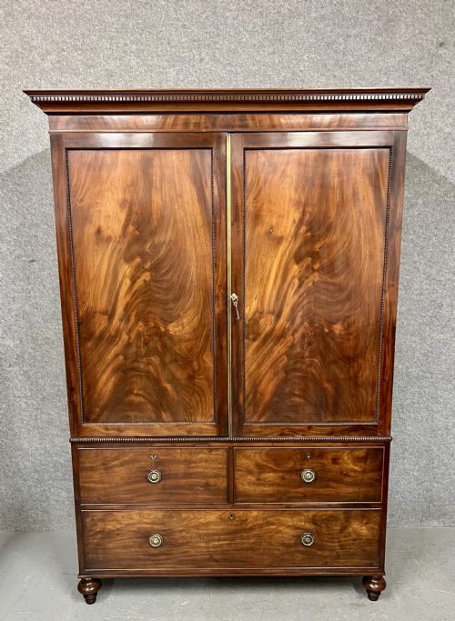 George III Figured Mahogany Linen Press