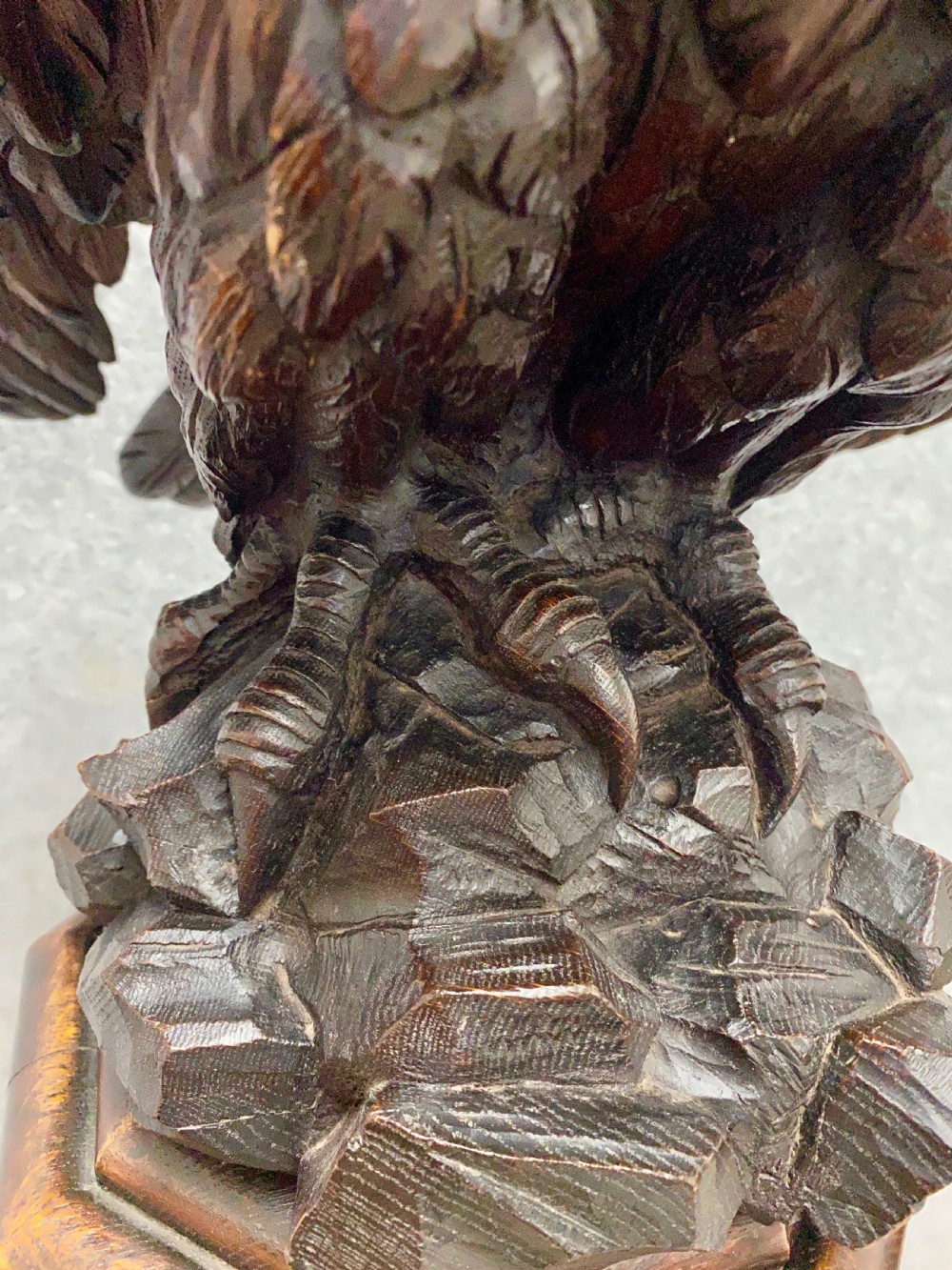 A dark carved oak eagle lectern featuring a sculpture of an eagle with wings spread mounted on an architectural pedestal stand. View IX