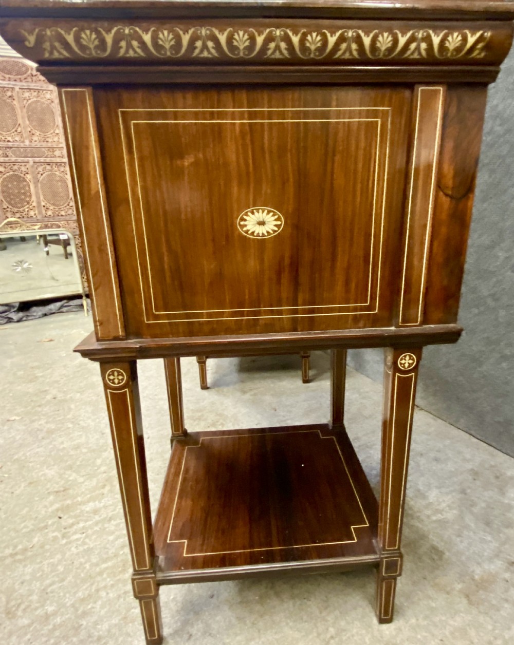 An Aesthetic Movement dark wood side cabinet featuring detailed marquetry inlays, an elevated superstructure with a central glazed cabinet, open niches, a mirror, a single drawer, and lower shelf spaces. View XVI