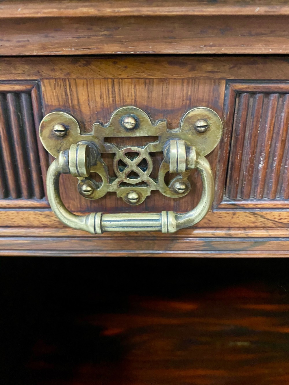 An antique inlaid rosewood side cabinet featuring glazed doors, mirrored inset panels, classical marquetry urn motifs, and a pediment top. View IX