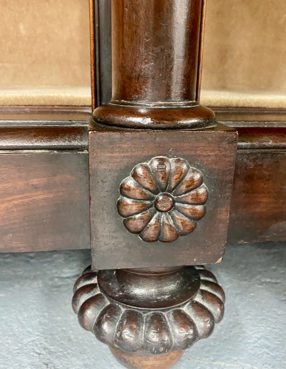A nineteenth-century mahogany side cabinet featuring reeded columns, carved rosettes, gadrooned feet, and glazed doors. View VII