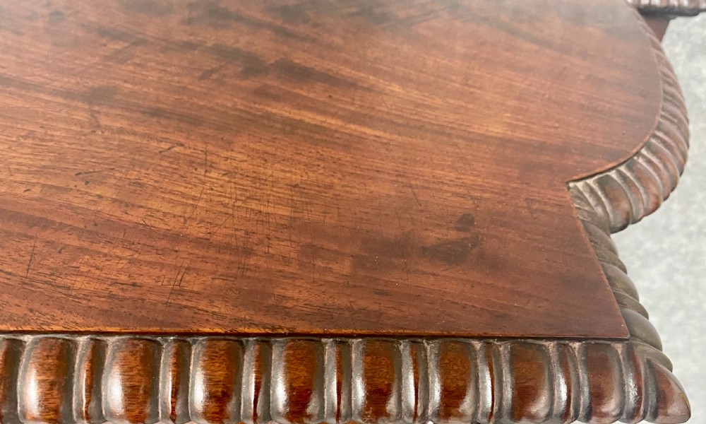 A nineteenth-century mahogany side cabinet featuring reeded columns, carved rosettes, gadrooned feet, and glazed doors. View XII