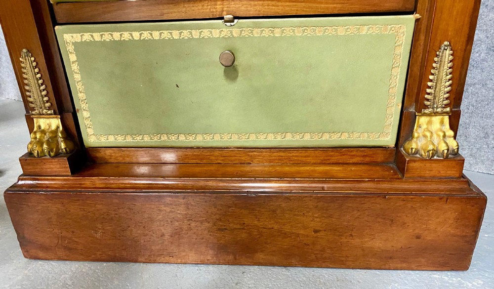 A pair of tall mahogany French Empire cartonnier chests featuring eight green gold-tooled leather drawers flanked by gilt ormolu mounts and terminal figures. View XI