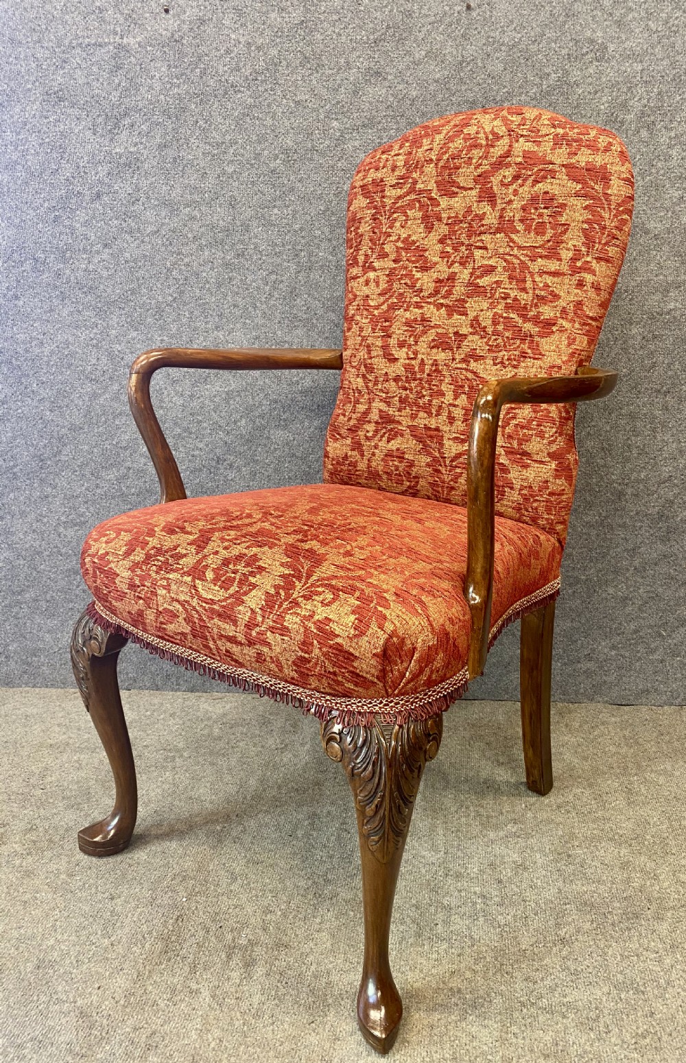 A nine-piece Queen Anne style dining room suite featuring a burr walnut dining table, matching sideboards, and red patterned fabric chairs with cabriole legs. View XI