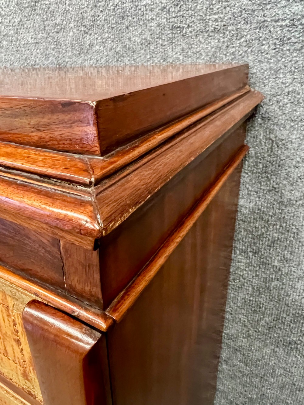 A tall French mahogany double Wellington chest with two vertical columns of light figured wood drawer fronts and a side locking pilaster. View XI