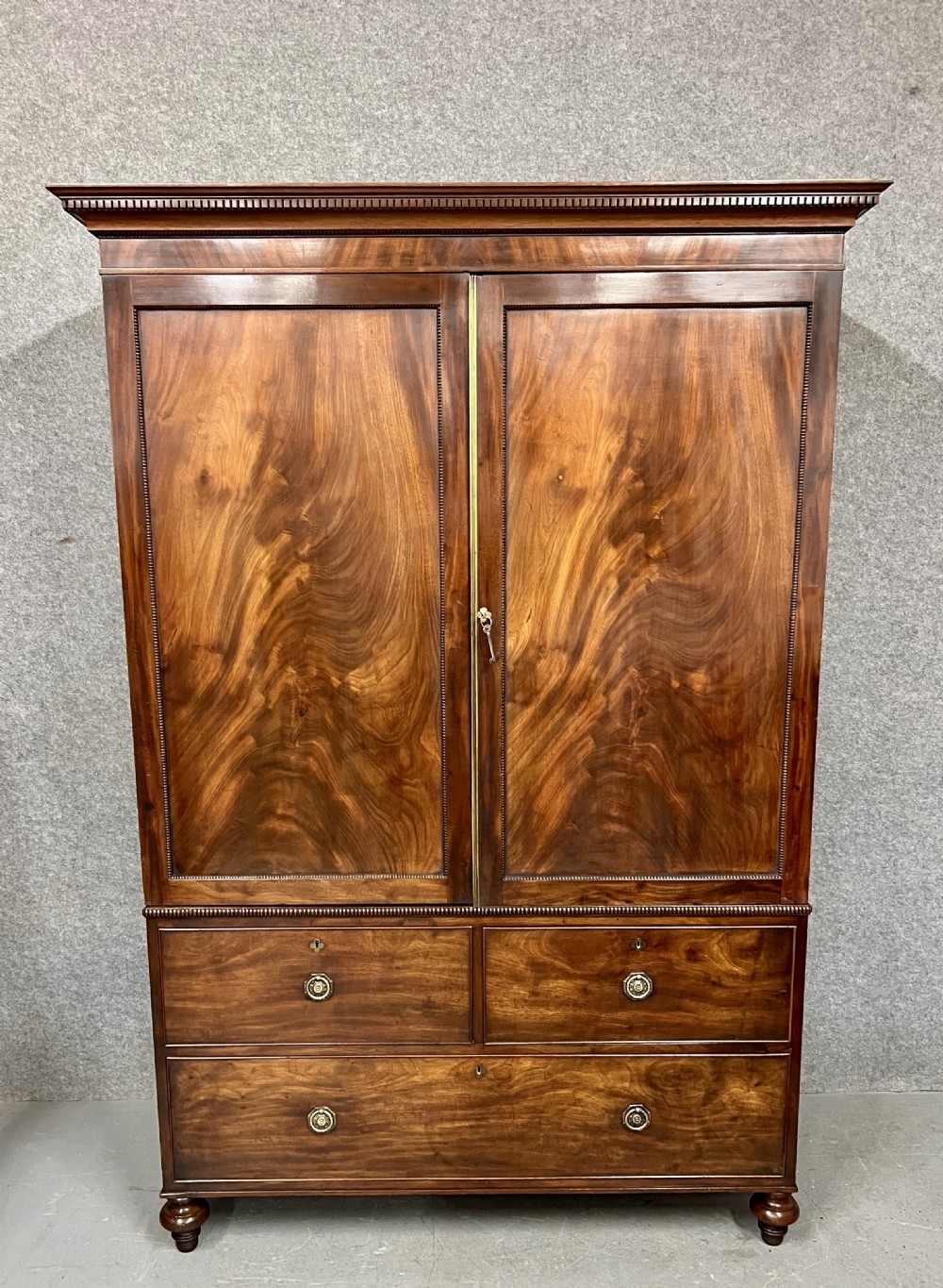 George III Figured Mahogany Linen Press