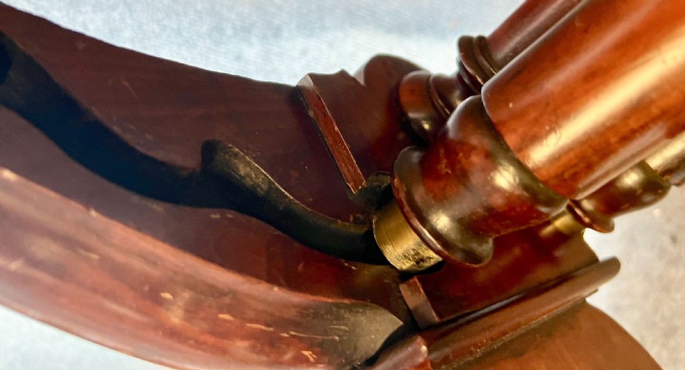 A George IV mahogany folio stand with hinged slatted frames, turned stretchers, and carved scrolled feet. View XI