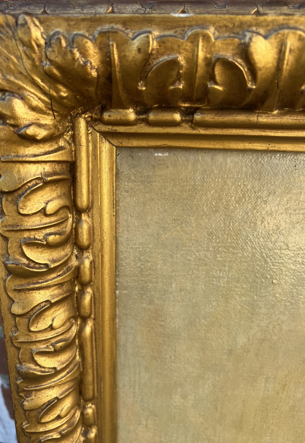 An oil painting on canvas depicting a gentleman in a suit and tie, set within a carved gold gilt frame. View IV