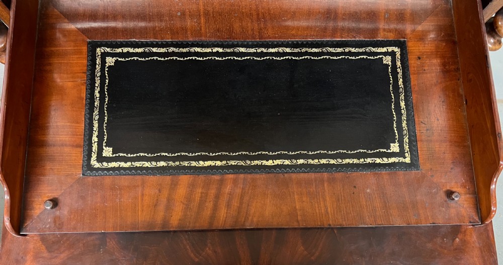 A 19th-century Biedermeier flame mahogany secretaire desk featuring spiralled barley twist columns, a fall-front writing surface, and a fitted interior cabinet. View VII