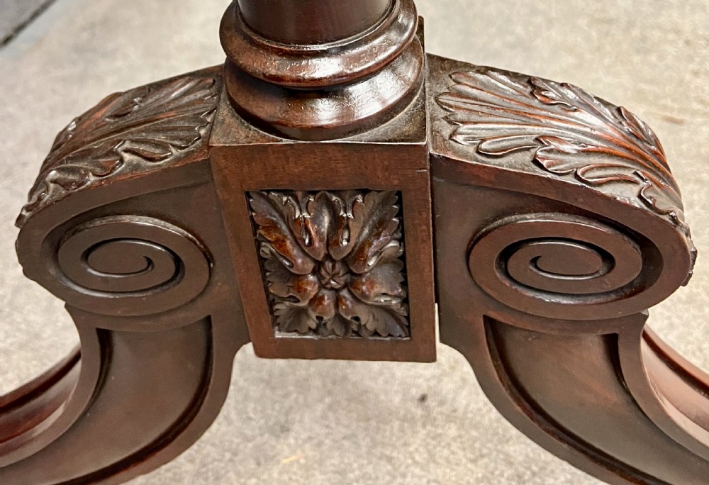 A Regency mahogany cheval mirror with a rectangular tilting frame, turned supports, and splayed legs on brass castors. View VIII