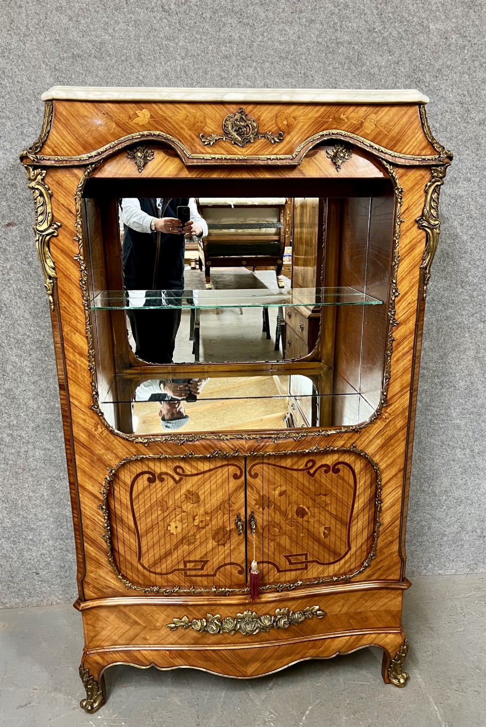 A French Louis XV style kingwood cocktail cabinet featuring floral marquetry inlays, ornate bronze mounts, and a marble top. View II