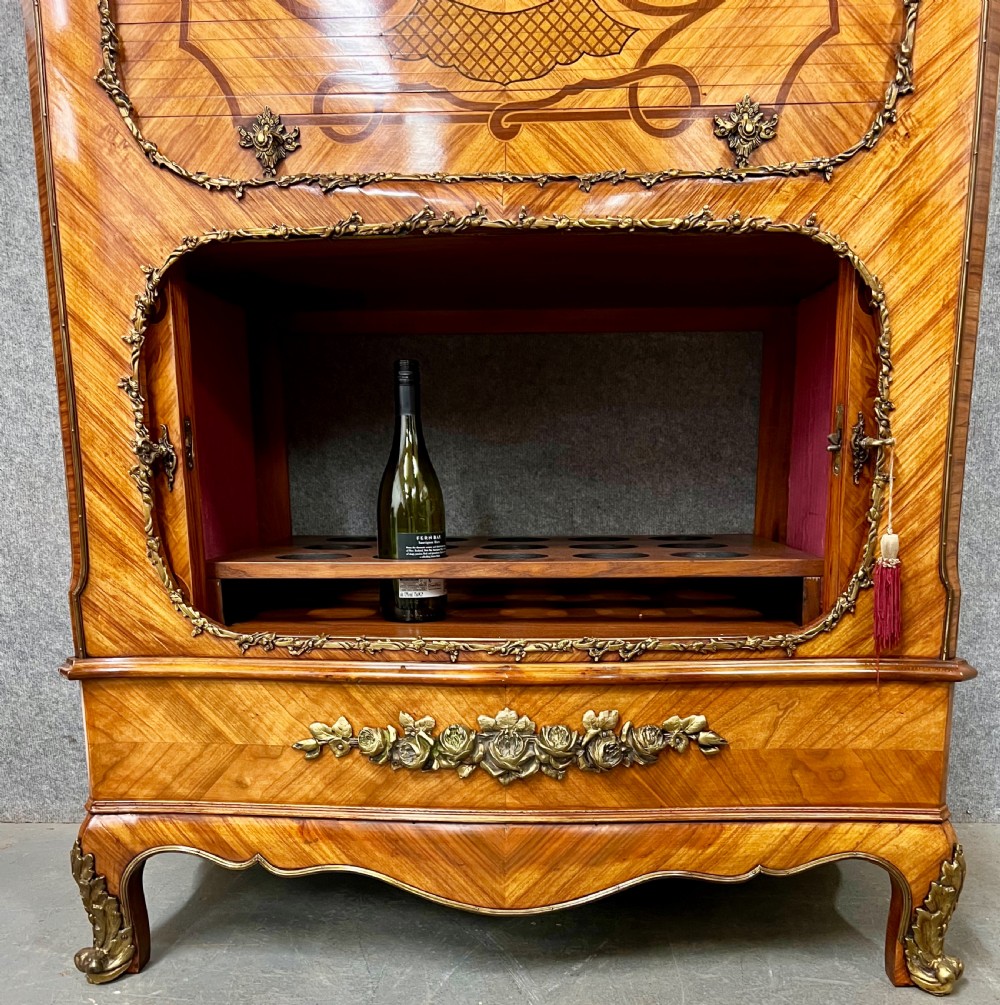 A French Louis XV style kingwood cocktail cabinet featuring floral marquetry inlays, ornate bronze mounts, and a marble top. View III