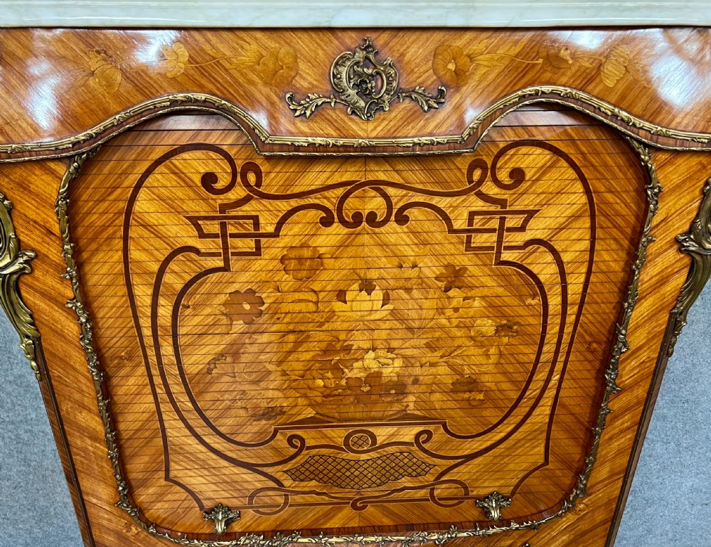 A French Louis XV style kingwood cocktail cabinet featuring floral marquetry inlays, ornate bronze mounts, and a marble top. View IV