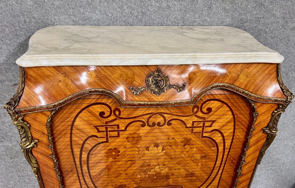 A French Louis XV style kingwood cocktail cabinet featuring floral marquetry inlays, ornate bronze mounts, and a marble top. View VII