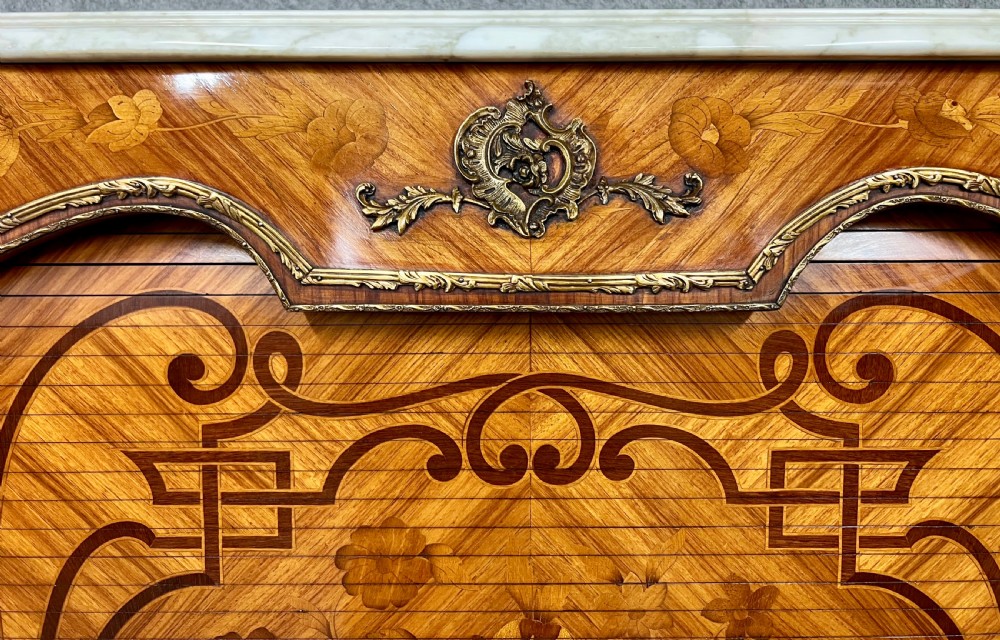 A French Louis XV style kingwood cocktail cabinet featuring floral marquetry inlays, ornate bronze mounts, and a marble top. View X