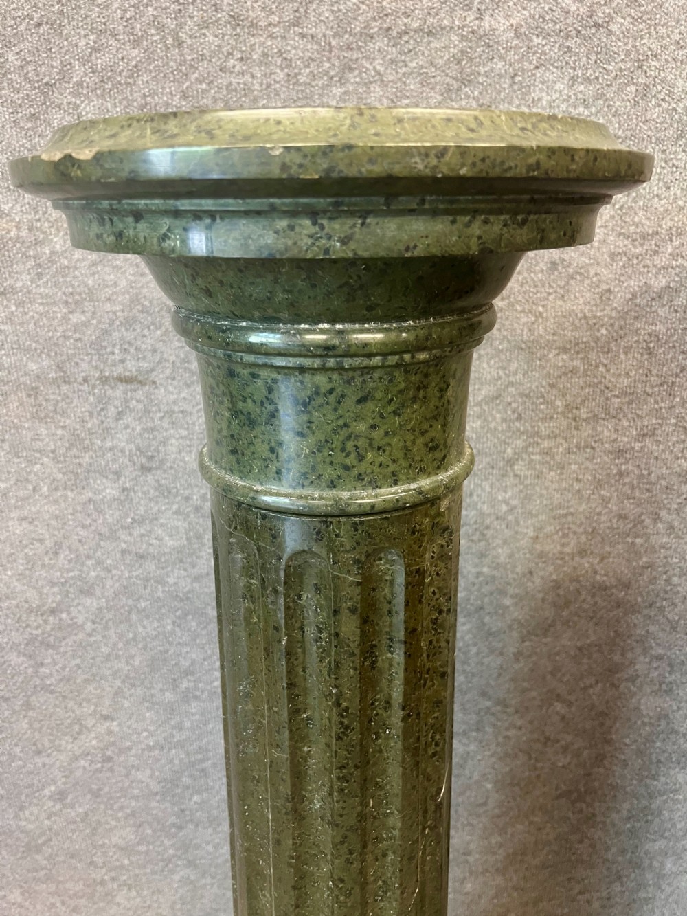 A pair of 19th-century carved dark green serpentine marble columns featuring fluted shafts, moulded capitals, and stepped octagonal bases. View II