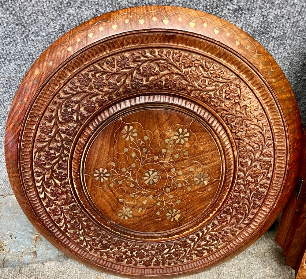 A small octagonal wooden side table featuring floral brass inlay on the top and pierced jali lattice panels on the base. View IX