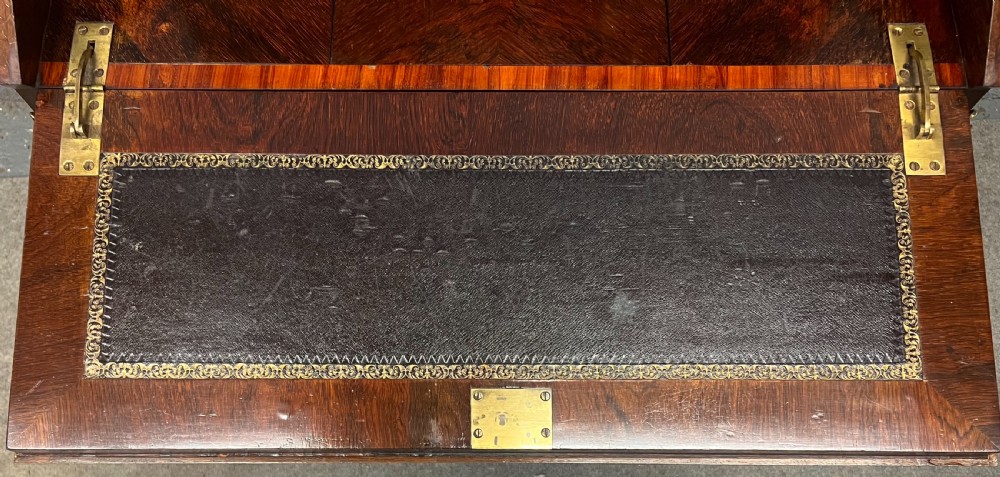 An antique Victorian inlaid walnut bureau de dame featuring a slant-front writing lid, floral marquetry, brass mounts, cabriole legs, and an upper cabinet with glazed doors. View VI