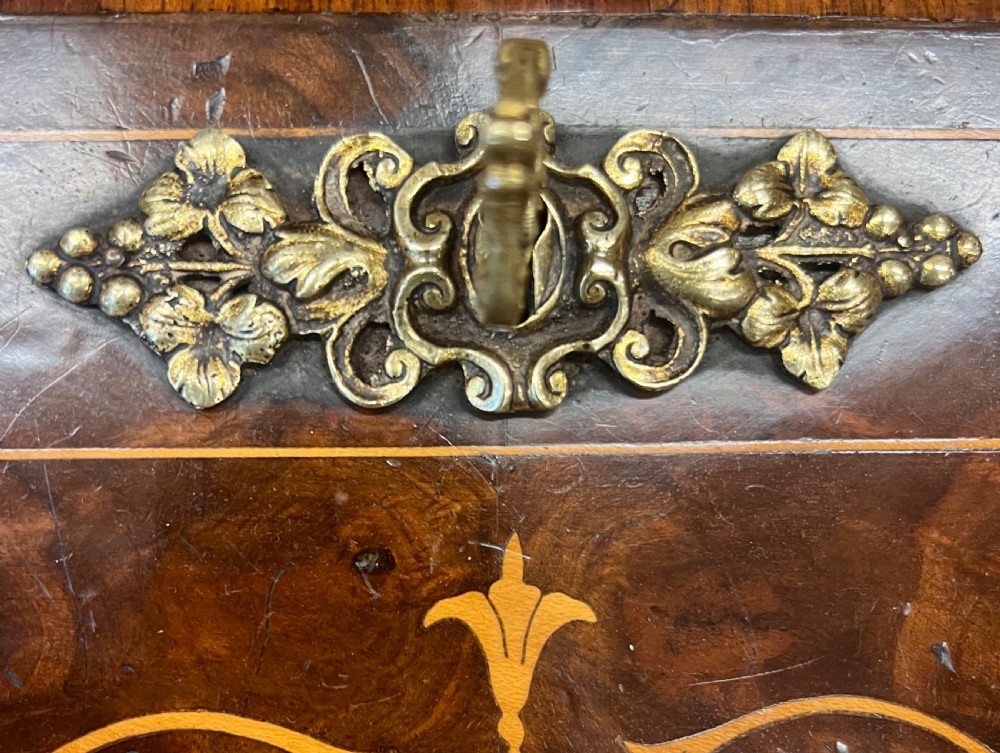 An antique Victorian inlaid walnut bureau de dame featuring a slant-front writing lid, floral marquetry, brass mounts, cabriole legs, and an upper cabinet with glazed doors. View X