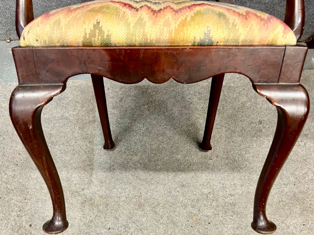 A dark mahogany George II style child armchair featuring a carved crest rail, vase-shaped back splat, shaped armrests, cabriole legs with pad feet, and a flame-stitch patterned seat. View VIII