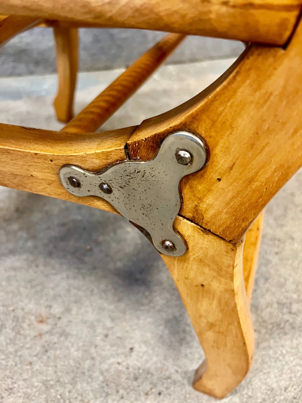 An antique French First World War campaign invalid chair constructed from light wood with woven cane panels and extending transport handles. View VIII